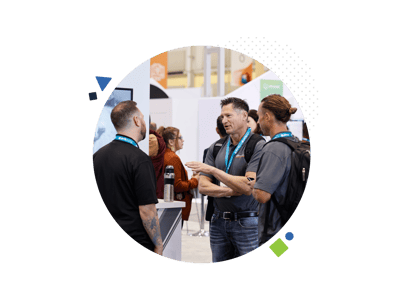 Map Your Show's Sales Accelerator offers Broader Reach. Connect with not just one lead but a network of potential buyers within an organization. Image shows three men chatting at a trade show/ fair